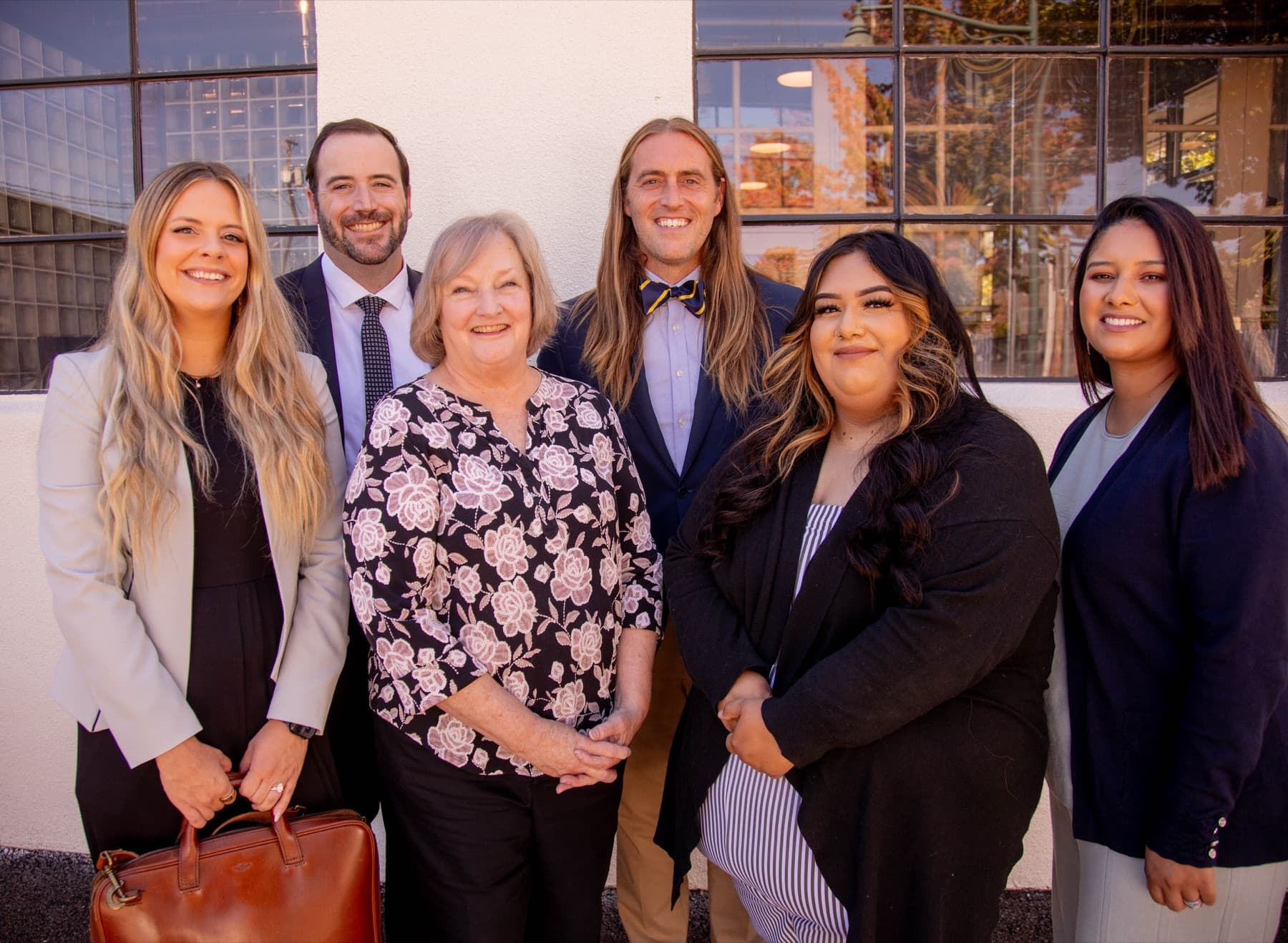 The six-person team of Abraham Hanson Law: attorneys Abraham Hanson, Hayley Capener, and Matthew Fouts with legal assistants Jennifer Cantera, Pieper Wardell, and Rejina Gordillo, outside the firm's McMinnville, Oregon office